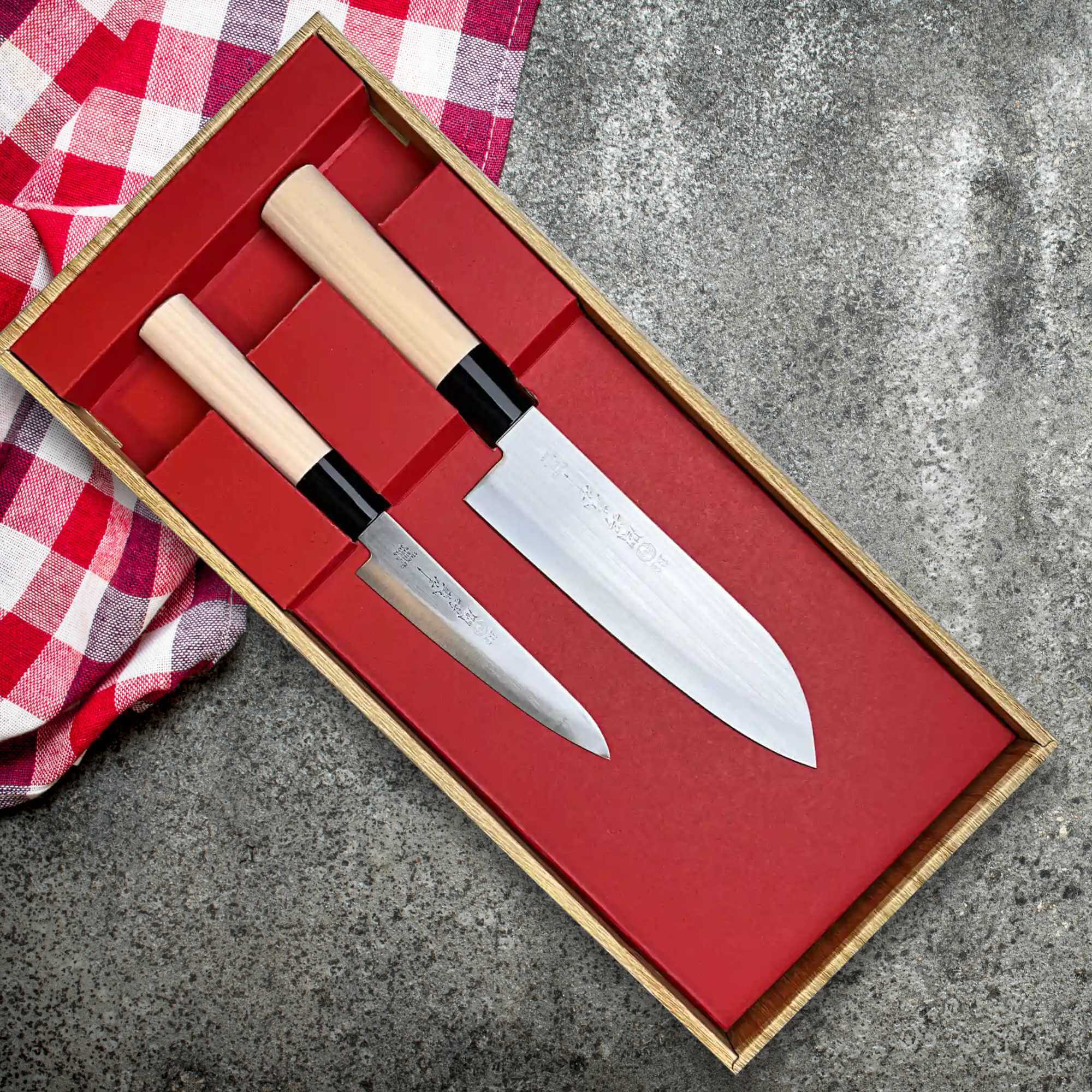 Tsubazo Japan Commercial Grade Japanese Knives in a wooden box with red interior and checkered cloth.