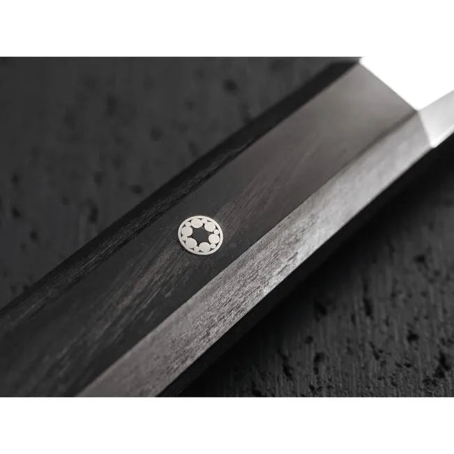 Close-up of the Miyabi 4000fc Japanese Kudamono Knife handle showcasing intricate craftsmanship and design details.