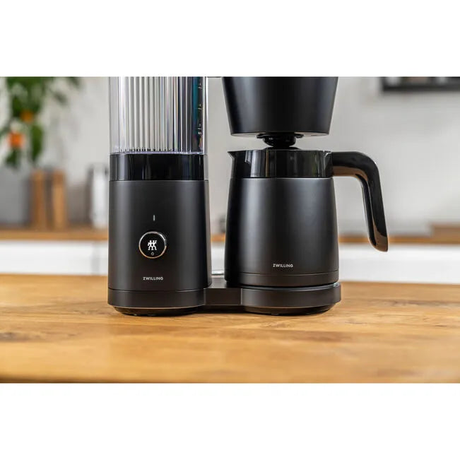 ZWILLING ENFINIGY Thermal Carafe Coffee Maker in black on wooden counter