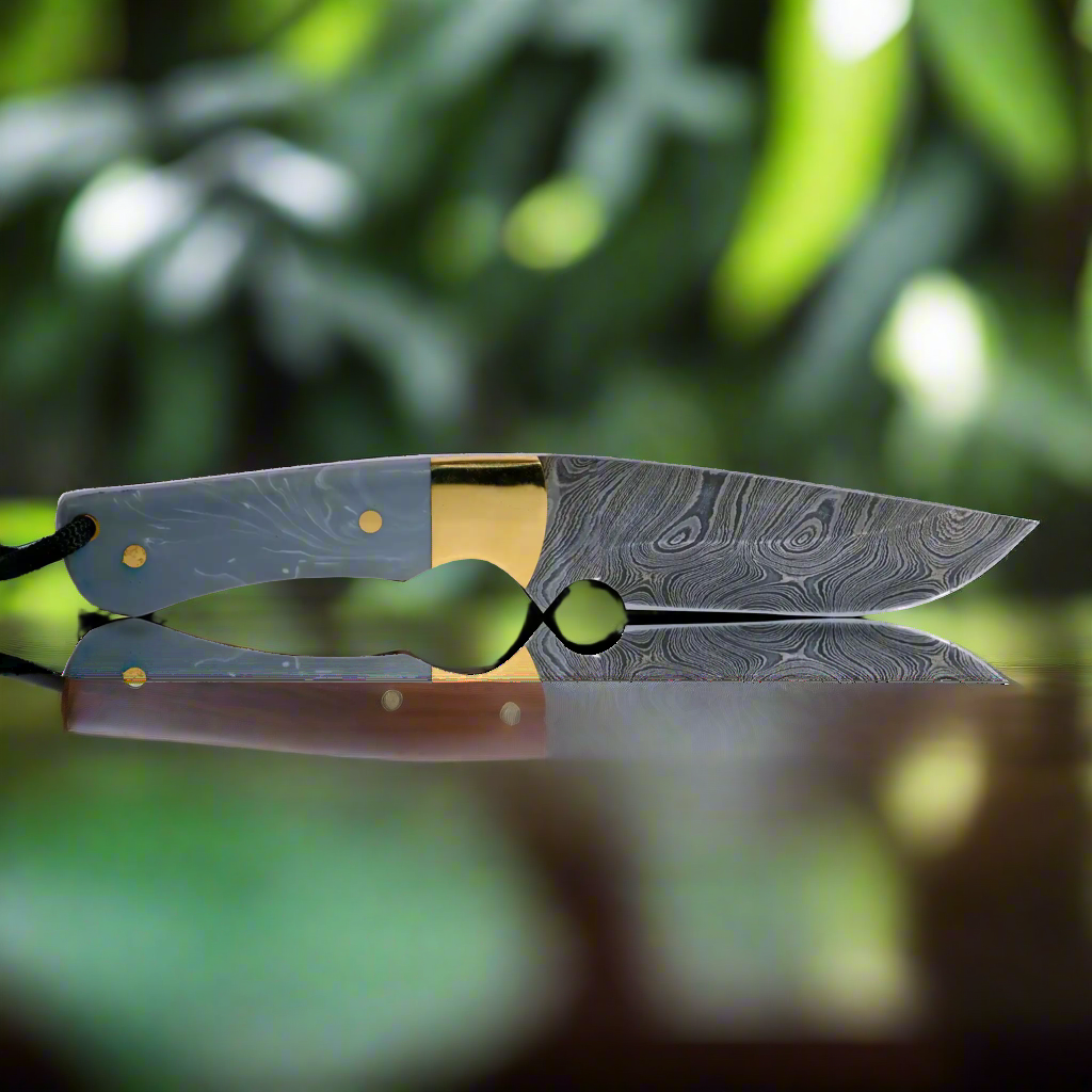 Ginza Steel Original Kaito Damascus Steel Skinner Knife - 4" Blade with Premium Leather Sheath on top of wooden table sport knife