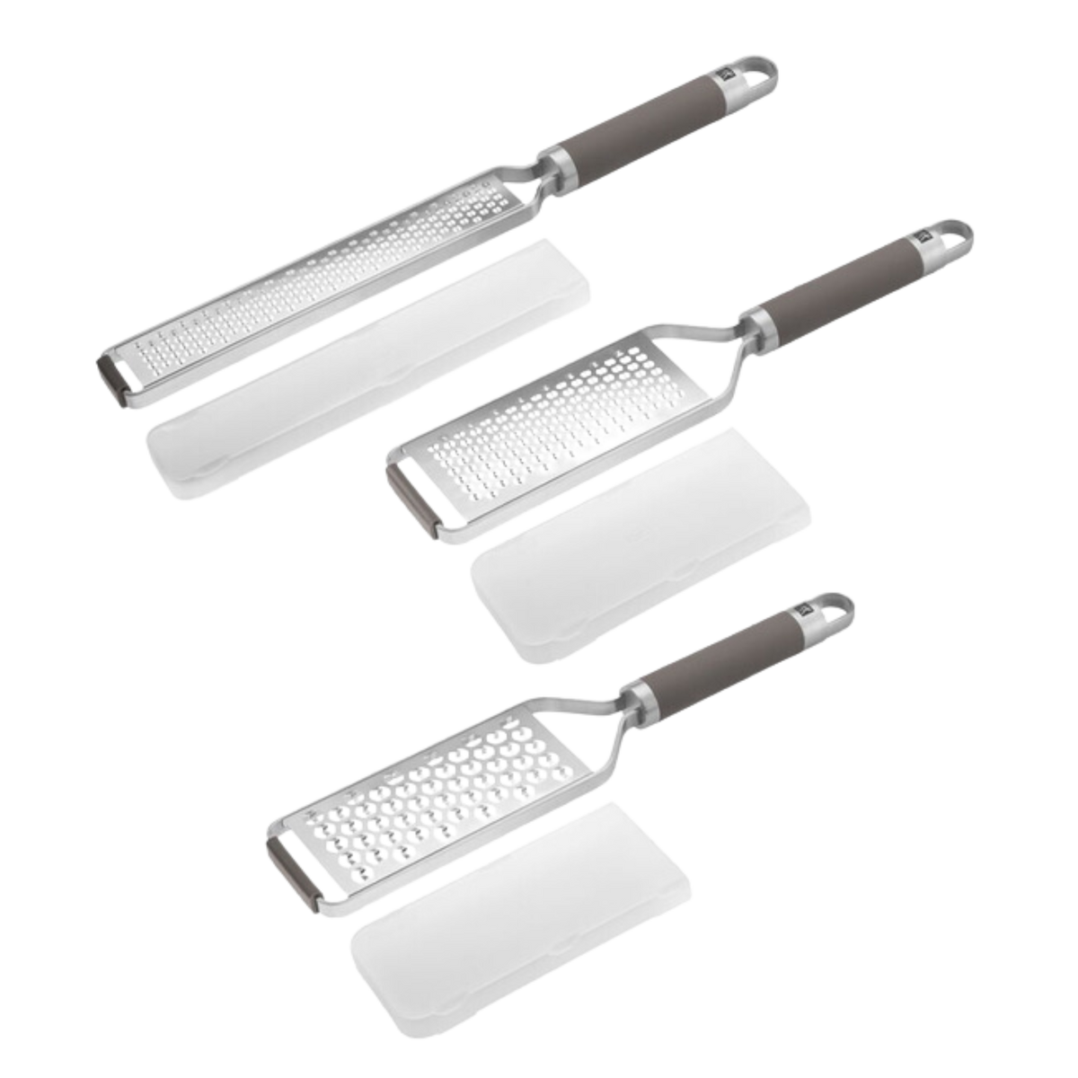 GreaterSet Three kitchen graters with dark gray handles and silver metal bodies, shown with white protective covers on a plain white background.