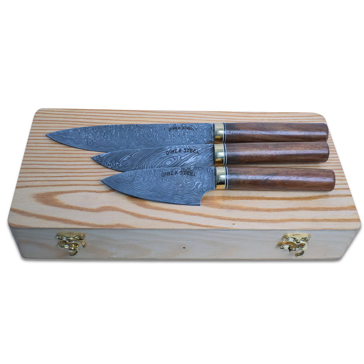 Sakura-II Damascus Steel Chef Knife set on a wooden box, featuring three handcrafted knives with intricate designs.