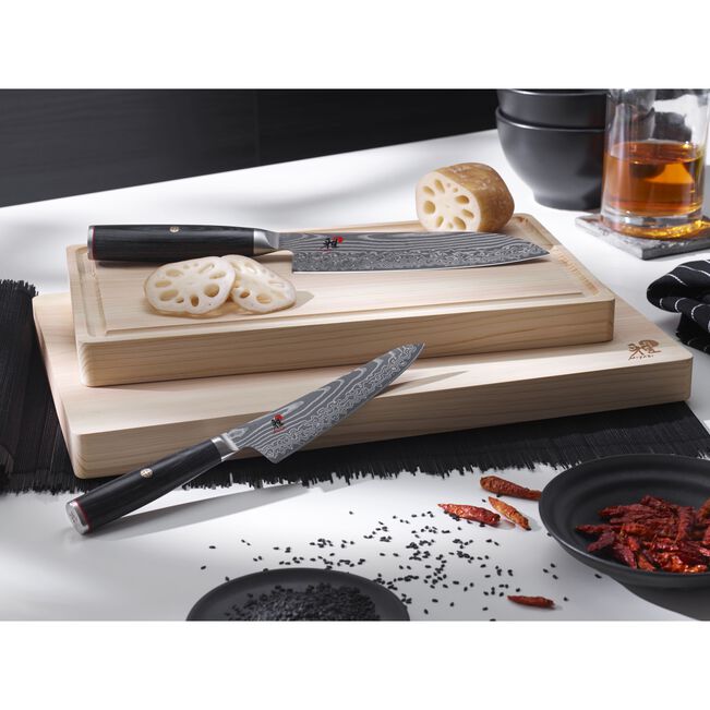 MIYABI Kaizen II 5000FCD 9.5-Inch Gyutoh Knife | Japan, Damascus Steel on top of cutting board