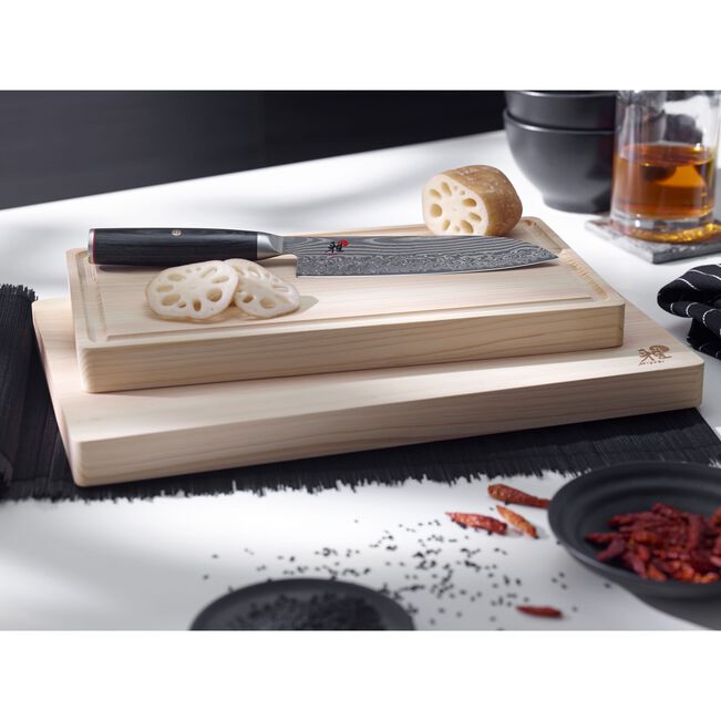 MIYABI Kaizen II 5000FCD 9.5-Inch Gyutoh Knife | Japan, Damascus Steel on top of cutting board