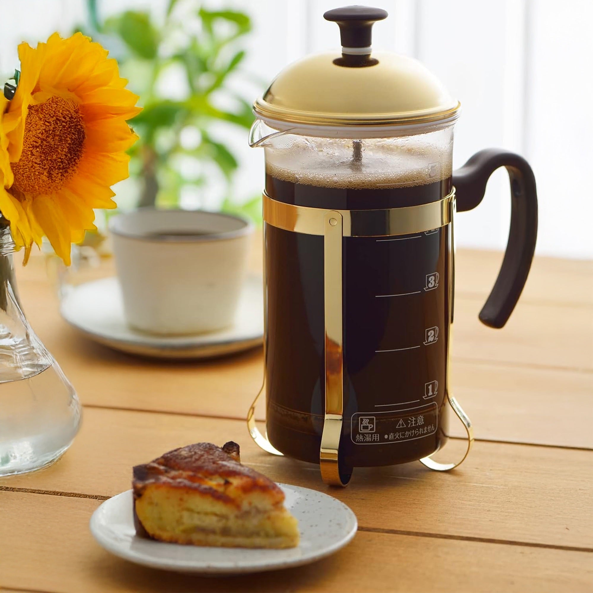 Yoshikawa Stainless Steel Coffee Press Server 600ml – Made in Japan on a table with coffee and pastry