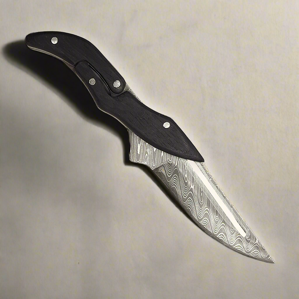 Ginza Steel X Fold-Stealth Damascus folding knife ebony handle natural light
