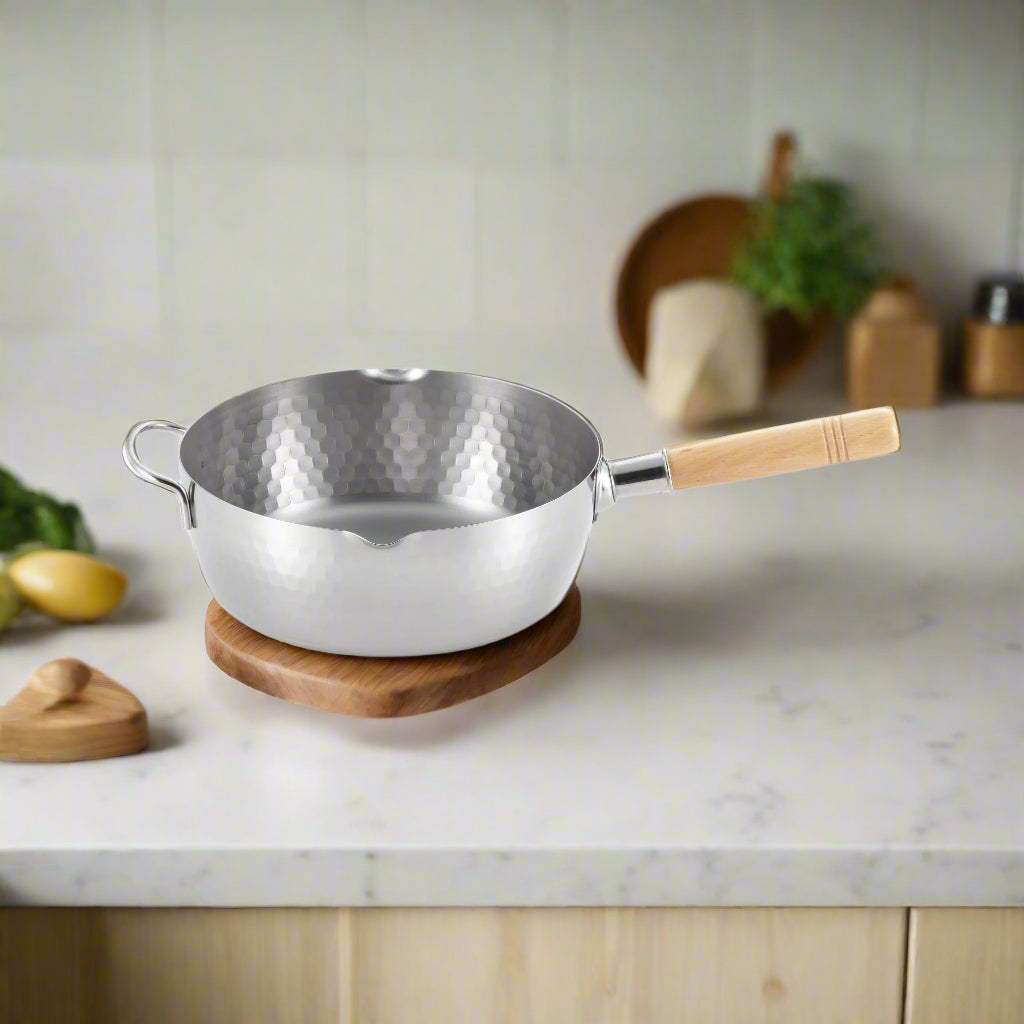 Yoshikawa Yukihira 24cm Pot stainless steel with wooden handle on a kitchen countertop.